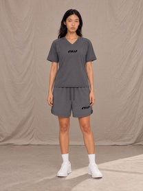 Model wearing SM Motion T-shirt in Deep Charcoal with SM Motion Oversized Court Shorts in Deep Charcoal, front view.