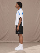 Model wearing SM Motion Vector Jersey in Lucent White, side view.