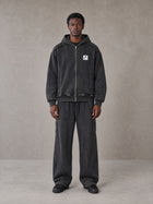 Model wearing the SM Arc Hoodie and SM Arc Sweatpants in Midnight Black, front view.