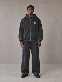 Model wearing the SM Arc Hoodie and SM Arc Sweatpants in Midnight Black, front view.