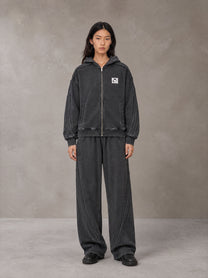 Model wearing the SM Arc Hoodie and SM Arc Sweatpants in Midnight Black, front view.