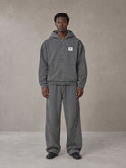 Model wearing the SM Arc Hoodie and SM Arc Sweatpants in Deep Charcoal, front view.