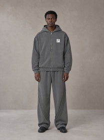 Model wearing the SM Arc Hoodie and SM Arc Sweatpants in Deep Charcoal, front view.