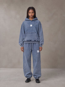 Model wearing the SM Denim Wash Hoodie and SM Denim Wash Sweatpants in Chambray, front view.