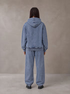 Model wearing the SM Denim Wash Hoodie and SM Denim Wash Sweatpants in Chambray, rear view.