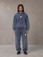 Model wearing the SM Denim Wash Hoodie and SM Denim Wash Sweatpants in Oxford Navy, front view.