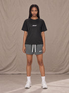 Model wearing the SM Motion Mesh Shorts in Ashen Grey, front view.