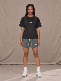 Model wearing the SM Motion Mesh Shorts in Ashen Grey, front view.