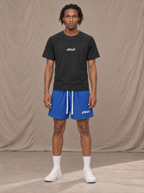 Model wearing the SM Motion Mesh Shorts in Klein Blue, front view.
