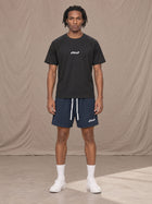 Model wearing the SM Motion Mesh Shorts in Oxford Navy, front view.