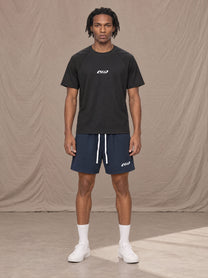 Model wearing the SM Motion Mesh Shorts in Oxford Navy, front view.