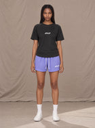 Model wearing the SM Motion Mesh Shorts in Pastel Violet, front view.