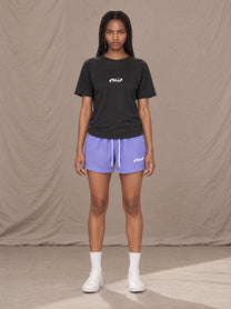 Model wearing the SM Motion Mesh Shorts in Pastel Violet, front view.