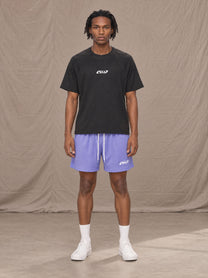 Model wearing the SM Motion Mesh Shorts in Pastel Violet, front view.