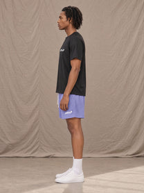 Model wearing the SM Motion Mesh Shorts in Pastel Violet, side profile.