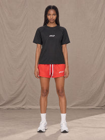 Model wearing the SM Motion Mesh Shorts in Watermelon Tint, front view.