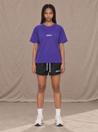 Model wearing the SM Motion Mesh T-shirt in Rich Violet, front view.