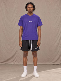 Model wearing the SM Motion Mesh T-shirt in Rich Violet, front view.