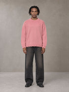 Model wearing the SM Sig. Washed Distress Knit Sweater in Blush Rose, front view.