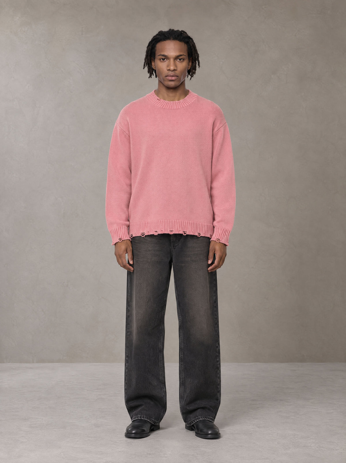 Model wearing the SM Sig. Washed Distress Knit Sweater in Blush Rose, front view.
