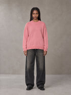 Model wearing the SM Sig. Washed Distress Knit Sweater in Blush Rose, front view.