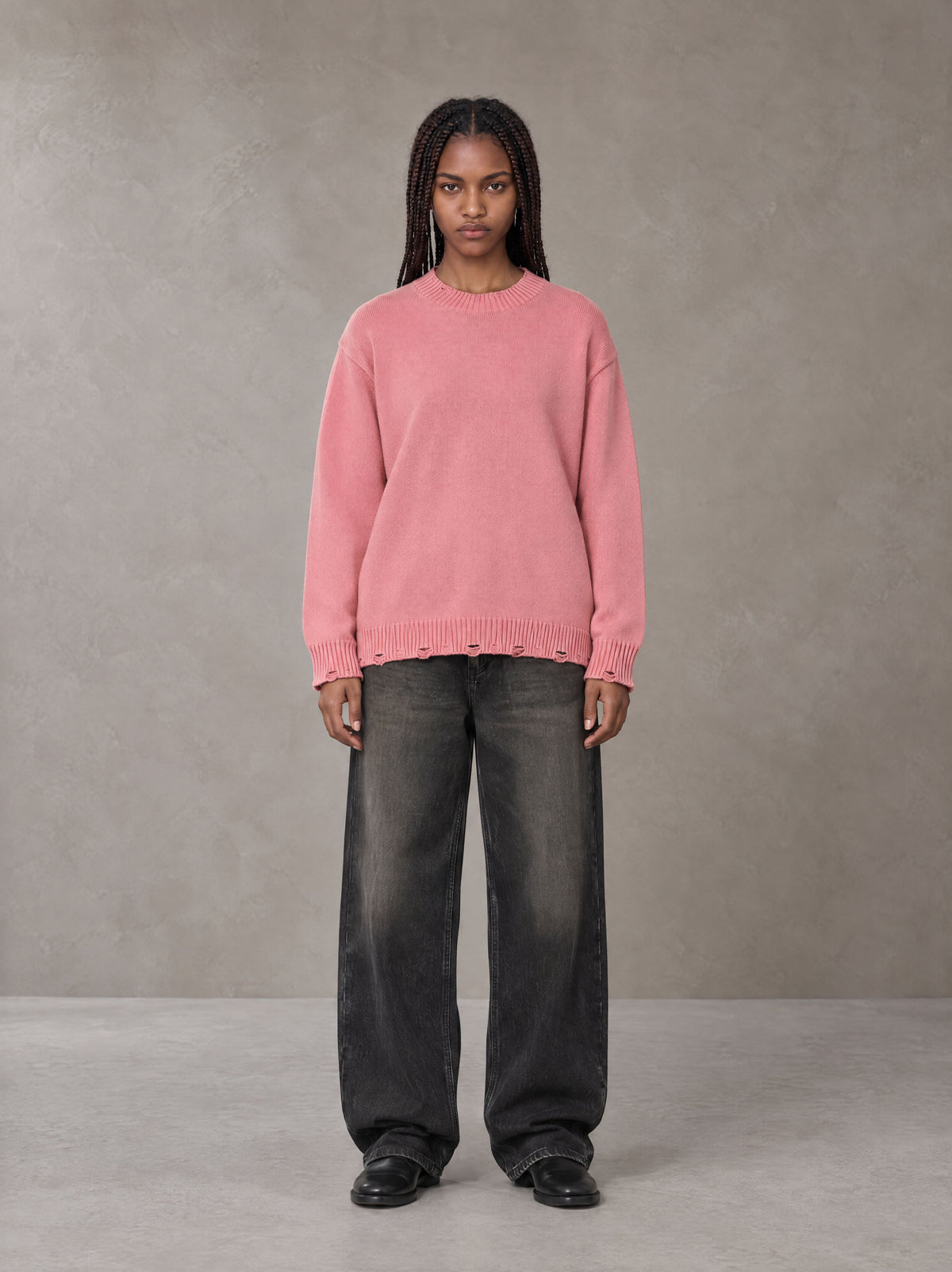 Model wearing the SM Sig. Washed Distress Knit Sweater in Blush Rose, front view.