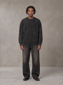 Model wearing the SM Sig. Washed Distress Knit Sweater in Midnight Black, front view.