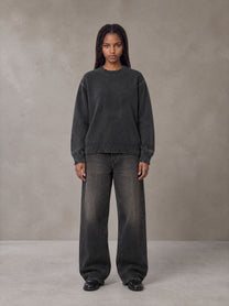 Model wearing the SM Sig. Washed Distress Knit Sweater in Midnight Black, front view.