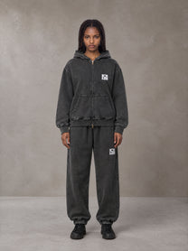 Model wearing the SM Denim Wash Zip Hoodie in Midnight Black, front view.