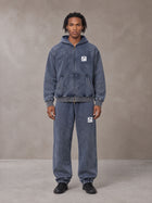 Model wearing the SM Denim Wash Zip Hoodie in Oxford Navy, front view.