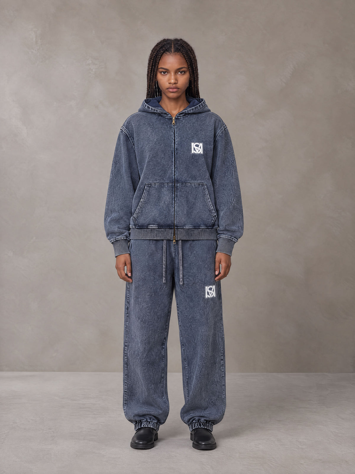 Model wearing the SM Denim Wash Zip Hoodie in Oxford Navy, front view.