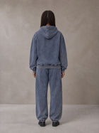 Model wearing the SM Denim Wash Zip Hoodie in Oxford Navy, rear view.