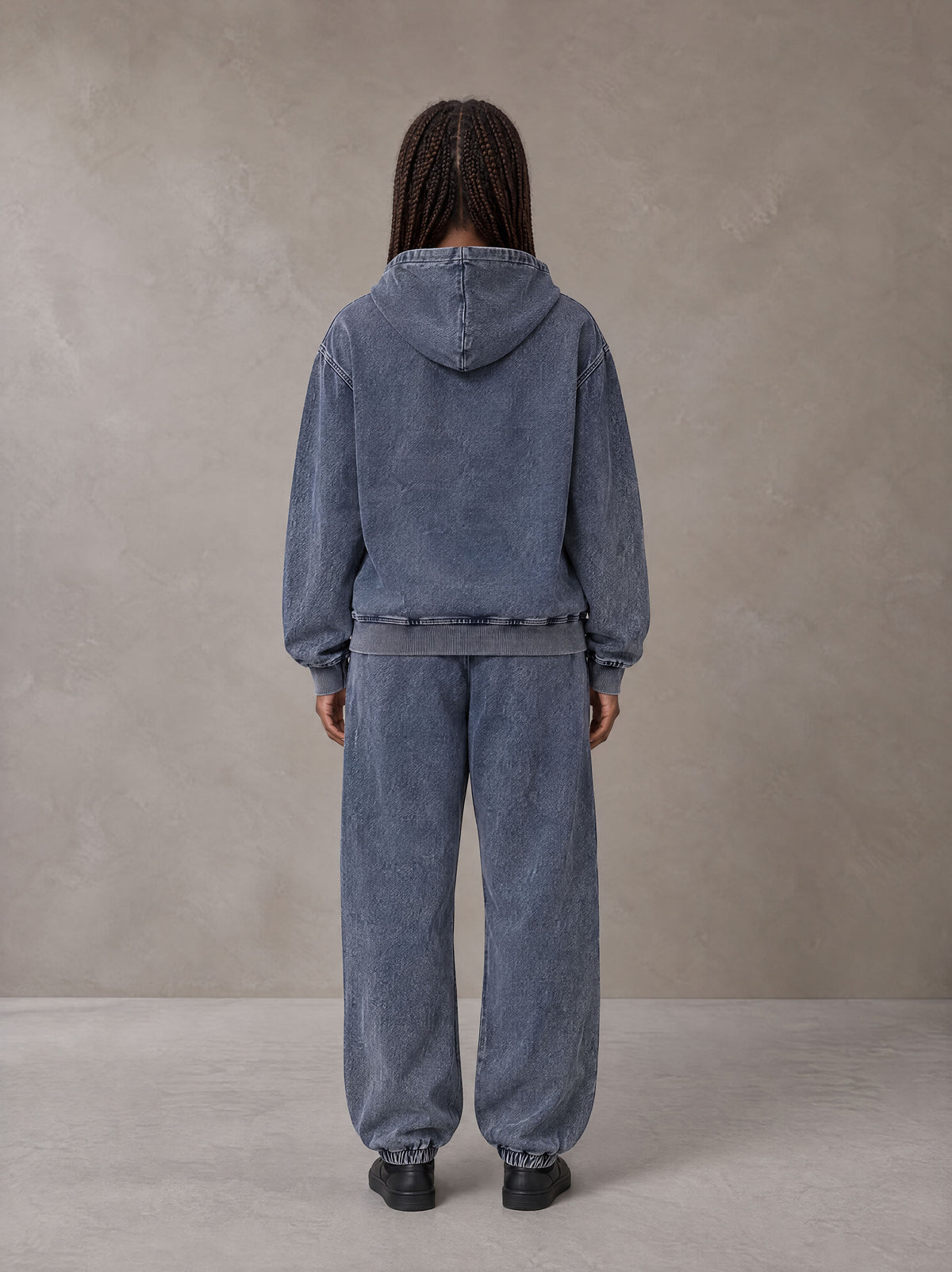 Model wearing the SM Denim Wash Zip Hoodie in Oxford Navy, rear view.