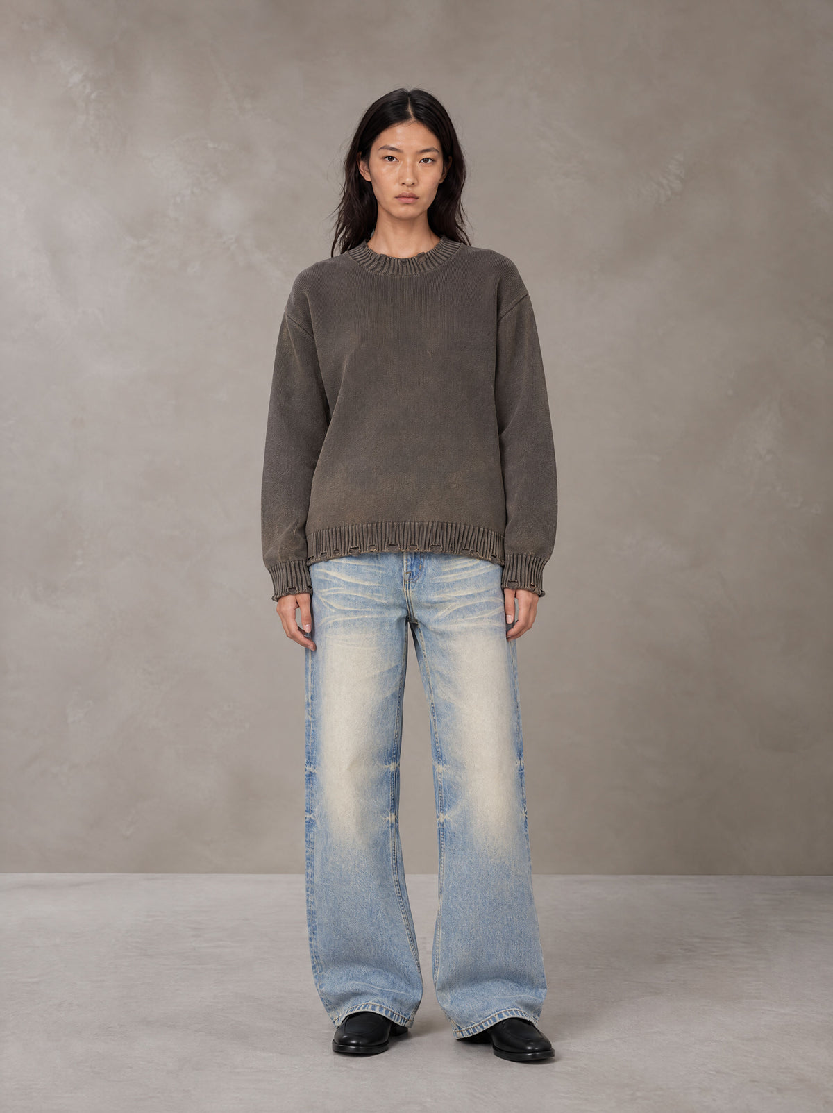 Model wearing the SM Heritage Fade Wide Leg Jeans in Cadet Grey, front view.
