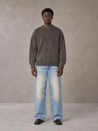 Model wearing the SM Heritage Fade Wide Leg Jeans in Cadet Grey, front view.