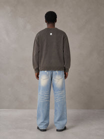 Model wearing the SM Heritage Fade Wide Leg Jeans in Cadet Grey, rear view.
