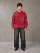 Model wearing the SM Sig. Washed Distress Knit Sweater in Deep Carmine, front view.