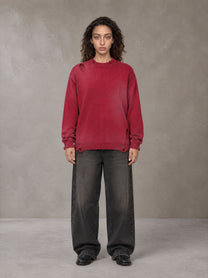 Model wearing the SM Sig. Washed Distress Knit Sweater in Deep Carmine, front view.