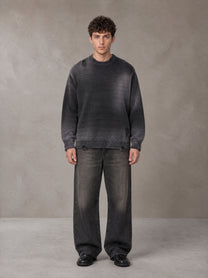 Model wearing the SM Sig. Washed Distress Knit Sweater in Midnight Black, front view.