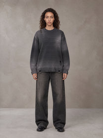 Model wearing the SM Sig. Washed Distress Knit Sweater in Midnight Black, front view.