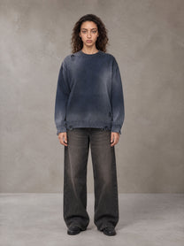 Model wearing the SM Sig. Washed Distress Knit Sweater in Oxford Navy, front view.