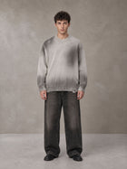 Model wearing the SM Sig. Washed Distress Knit Sweater in Warm Grey, front view.
