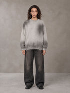 Model wearing the SM Sig. Washed Distress Knit Sweater in Warm Grey, front view.