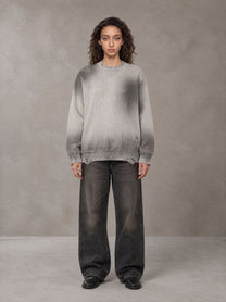 Model wearing the SM Sig. Washed Distress Knit Sweater in Warm Grey, front view.