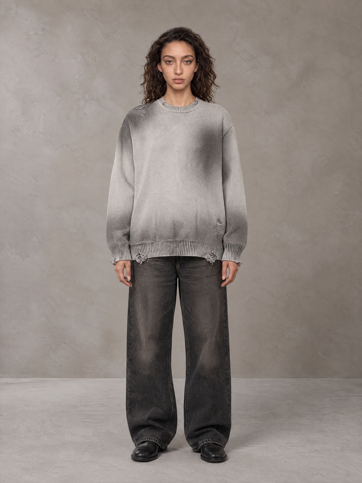 Model wearing the SM Sig. Washed Distress Knit Sweater in Warm Grey, front view.