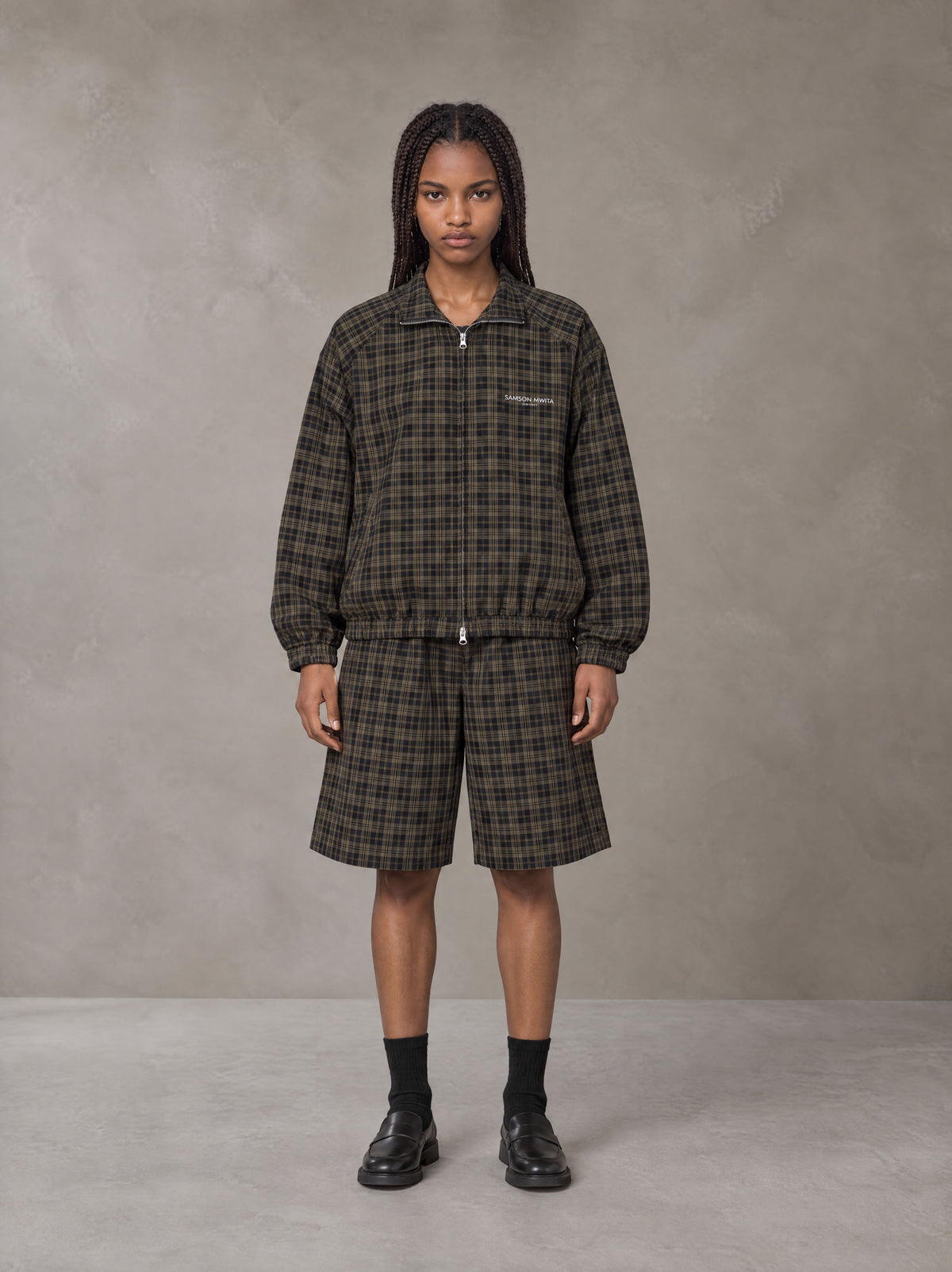 Model wearing the SM Meridian Shorts in Loden, front view.
