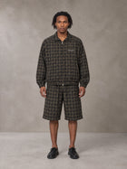 Model wearing the SM Meridian Shorts in Loden, front view.