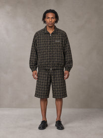 Model wearing the SM Meridian Shorts in Loden, front view.