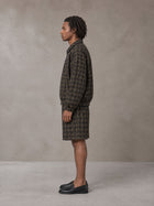 Model wearing the SM Meridian Shorts in Loden, side profile.