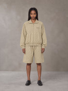 Model wearing the SM Meridian Shorts in Ecru, front view.